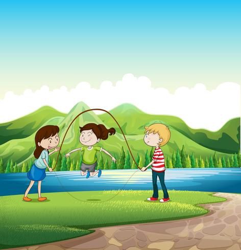 Tre bambini che giocano vicino al fiume vettore