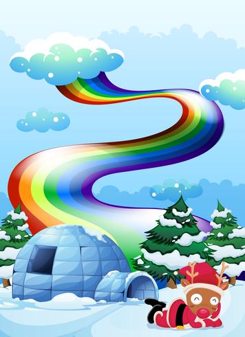 Un arcobaleno sopra l&#39;igloo accanto alla renna vettore