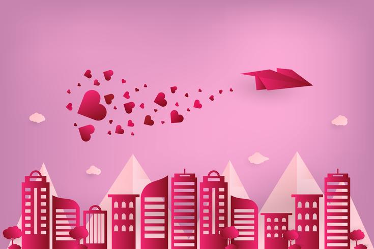 Concetto amore e giorno di San Valentino. Aereo di carta origami che sorvola città urbana con cuore spargere sul cielo. stile di arte cartacea. vettore