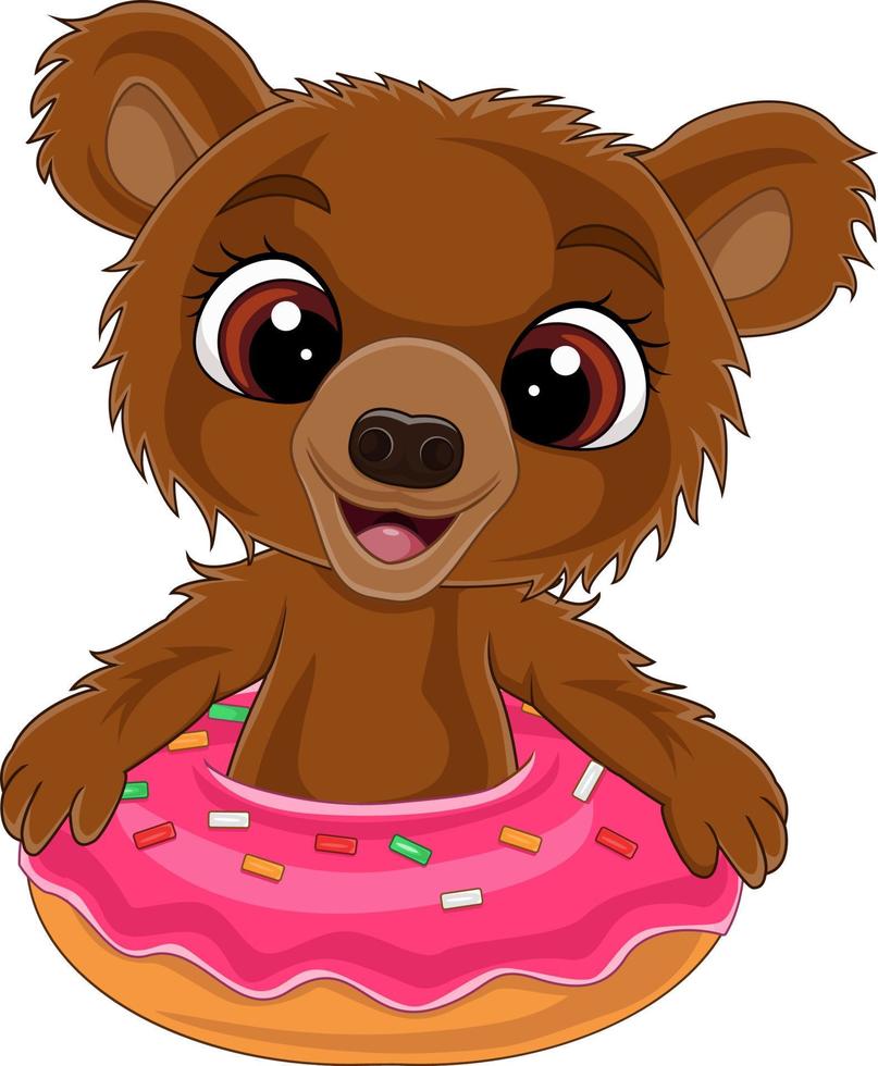 cartone animato divertente bambino orso all'interno della ciambella vettore