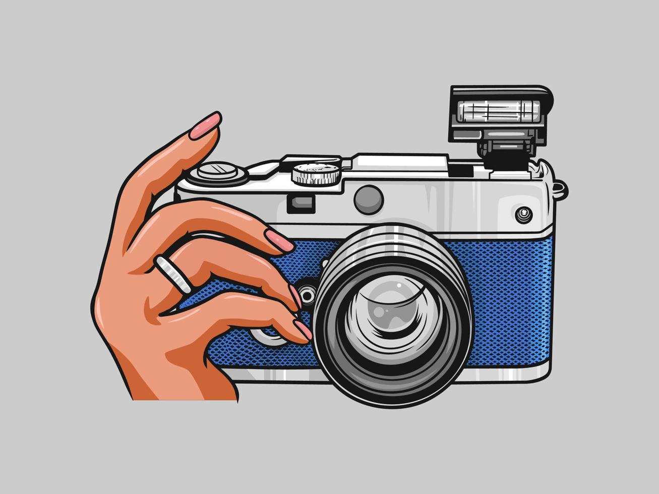 mano che tiene l'illustrazione del logo dello studio di vettore della fotocamera digitale