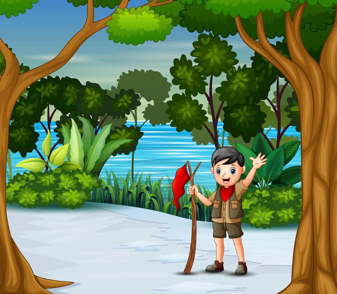un ragazzo scout con bandiera rossa nella foresta invernale vettore