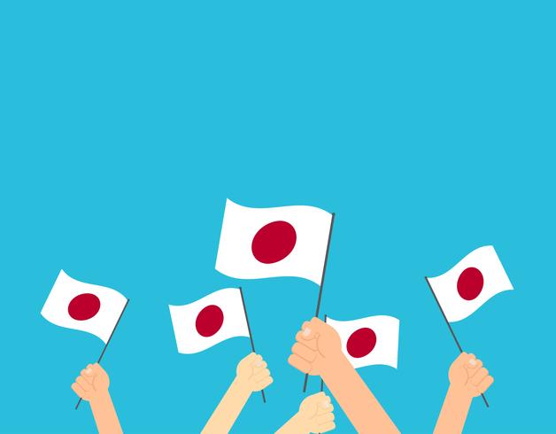 Illustrazione vettoriale mani che tengono le bandiere del Giappone su sfondo blu