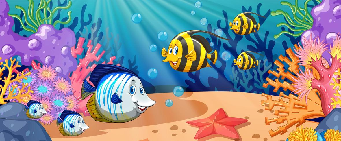 Nuoto dei pesci del fumetto sotto l&#39;oceano vettore