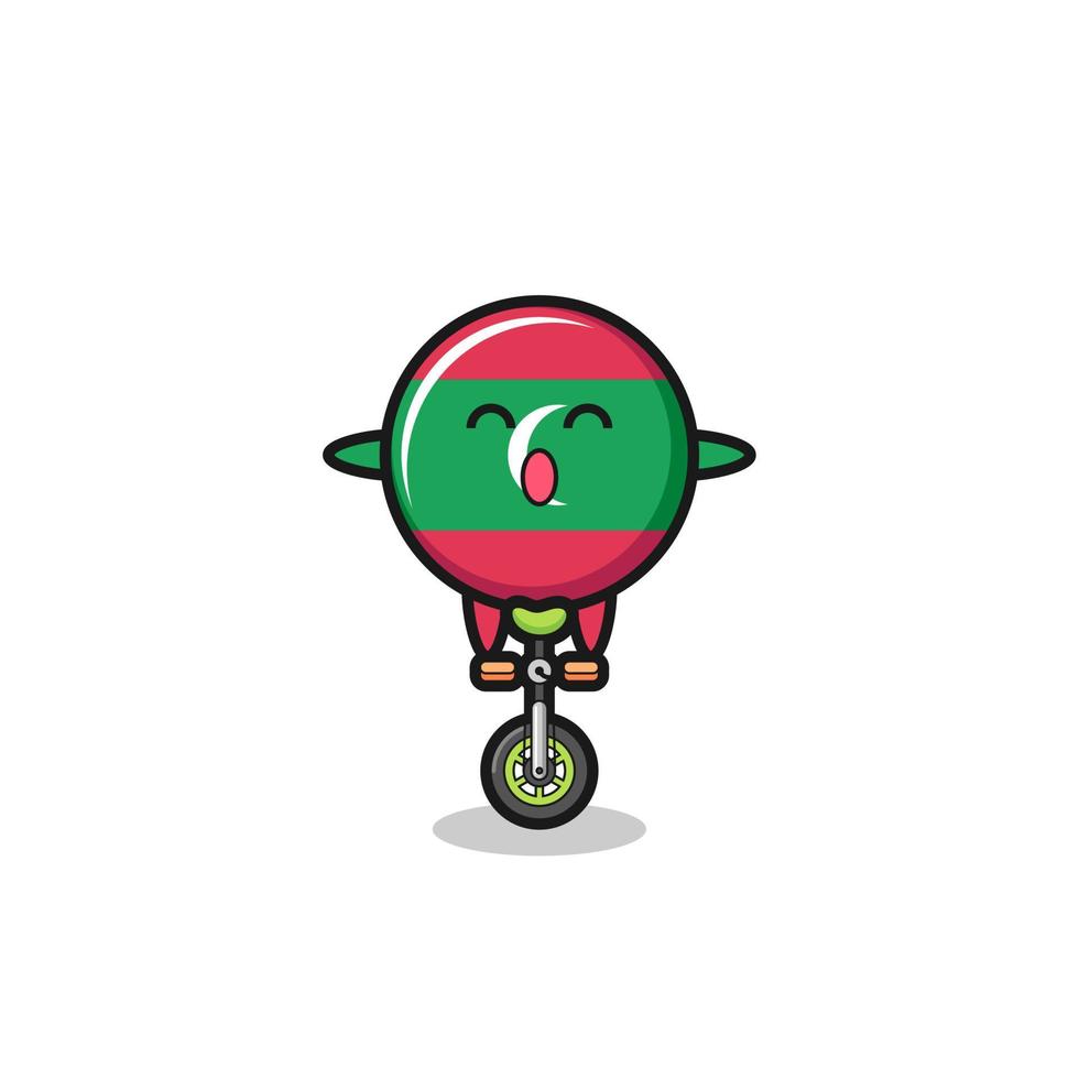 il simpatico personaggio della bandiera delle Maldive sta guidando una bici da circo vettore