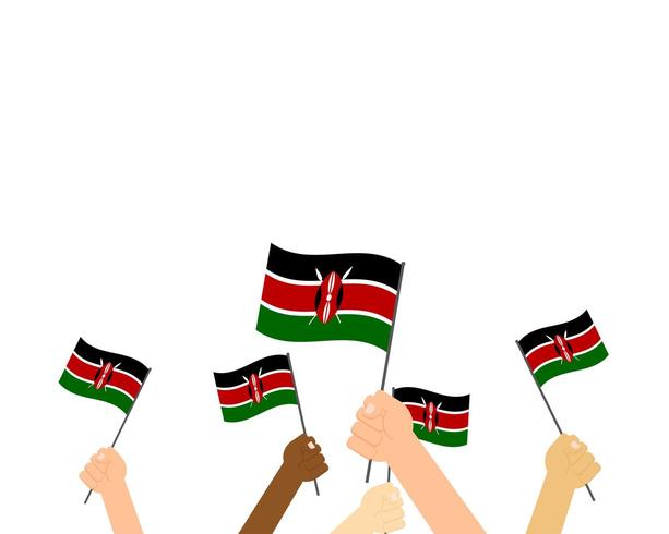 Mani che tengono le bandiere del Kenya vettore