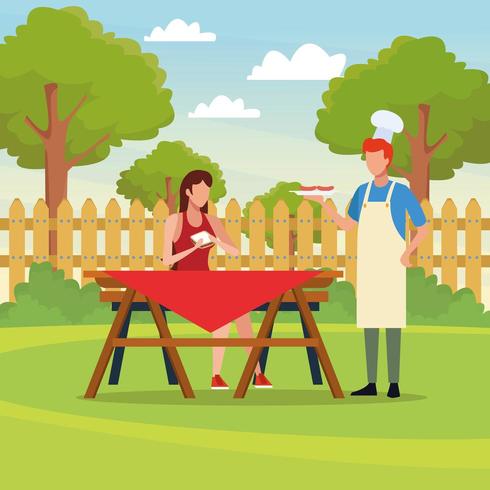 Picnic in famiglia con barbecue vettore