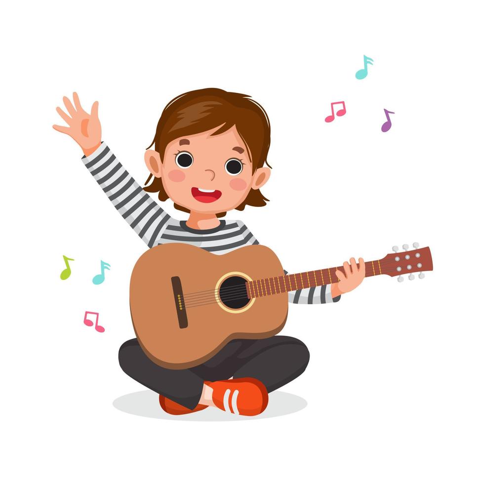 bambina felice che suona la chitarra seduta sul pavimento agitando la mano con l'espressione facciale sorridente vettore