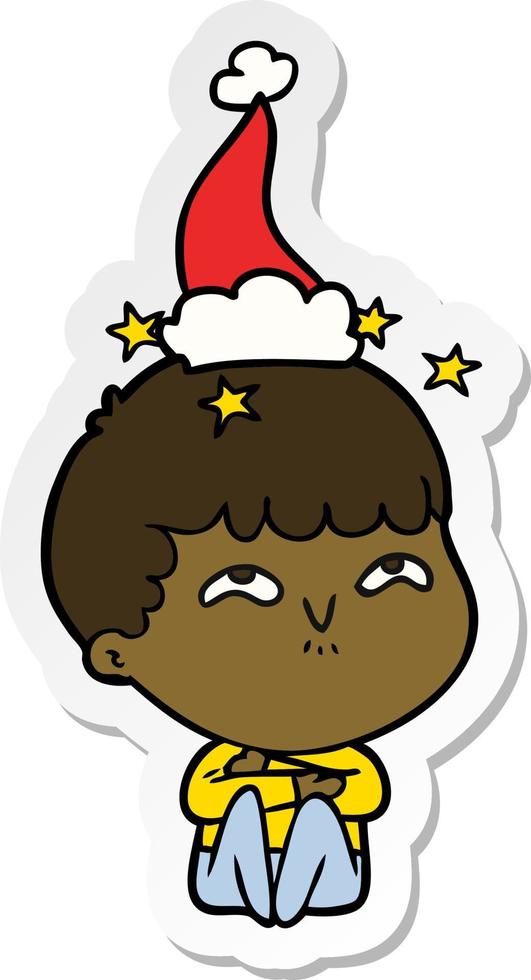 cartone animato adesivo di un ragazzo stupito che indossa il cappello di Babbo Natale vettore