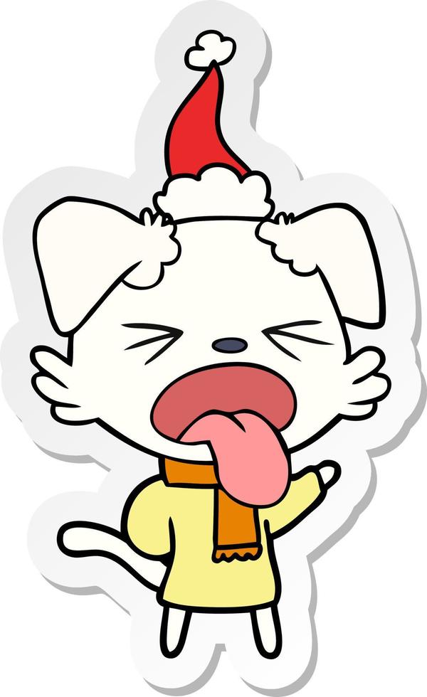 adesivo cartone animato di un cane che indossa sciarpa e pullover con cappello da Babbo Natale vettore