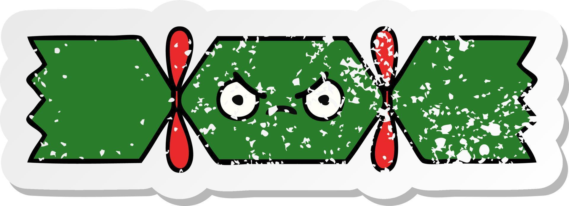 adesivo in difficoltà di un simpatico cartone animato cracker di Natale vettore