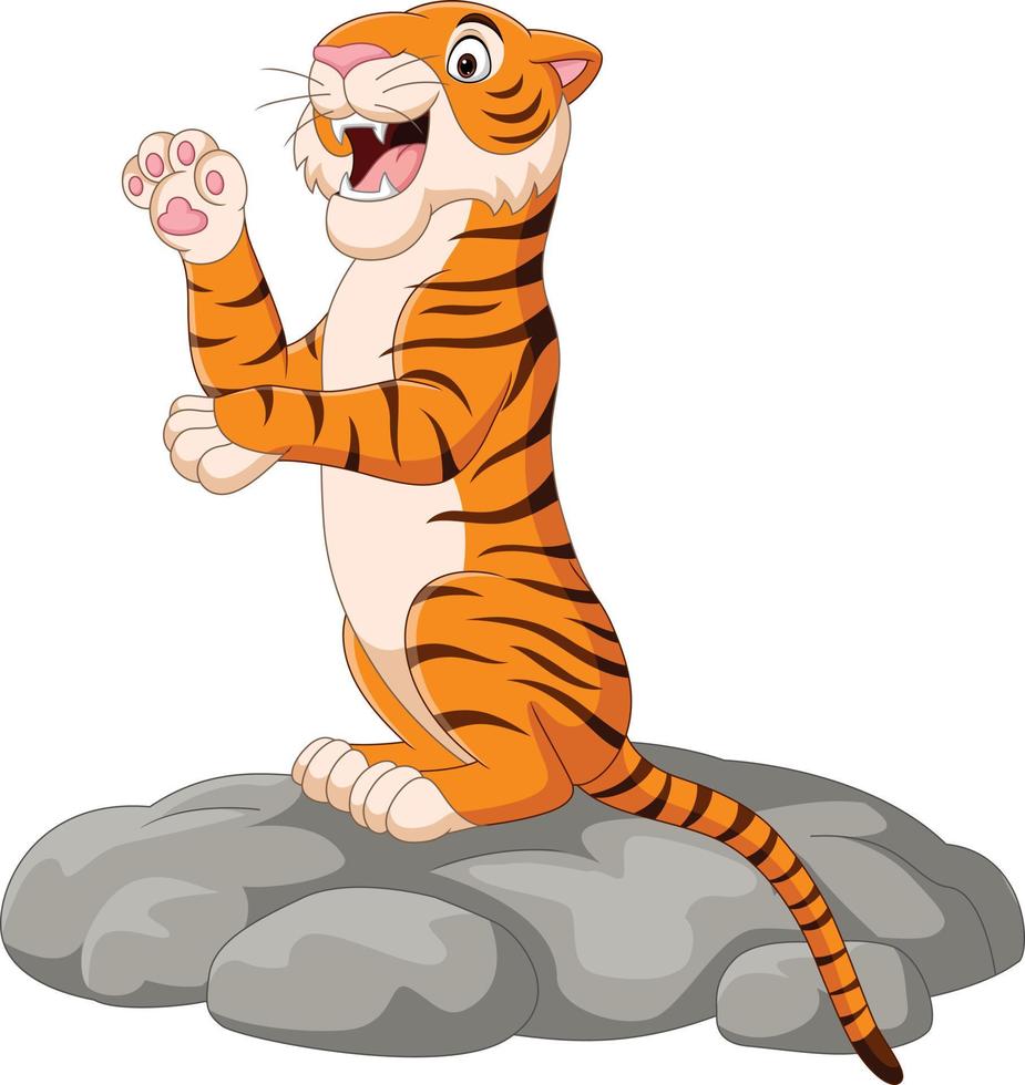 tigre del fumetto che posa sulla roccia vettore