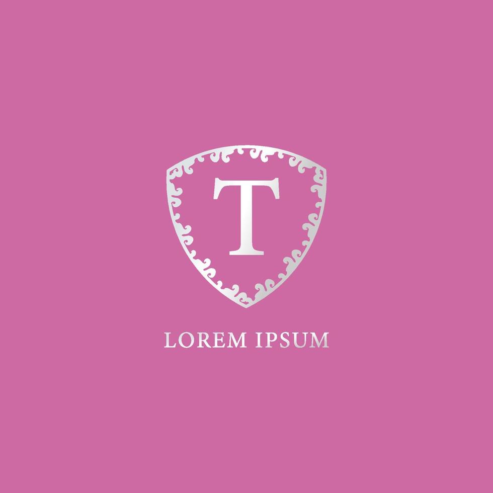 modello di progettazione del logo iniziale della lettera t. adatto per prodotti assicurativi, moda e bellezza. illustrazione di scudo floreale decorativo d'argento di lusso. isolato su sfondo di colore rosa. vettore
