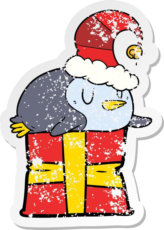 adesivo angosciato di un pinguino cartone animato che indossa un cappello di Natale vettore