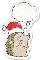 riccio di cartone animato che indossa un cappello di Natale e una bolla di pensiero come un adesivo consumato in difficoltà vettore