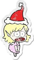 adesivo angosciato cartone animato di una ragazza elfo scioccata che indossa il cappello di Babbo Natale vettore