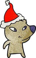 simpatico cartone animato strutturato di un orso che indossa il cappello di Babbo Natale vettore