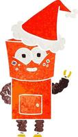 felice retrò cartone animato di un robot che saluta con un cappello da Babbo Natale vettore