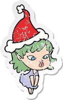 cartone animato adesivo piuttosto angosciato di una ragazza elfo che indossa il cappello di Babbo Natale vettore