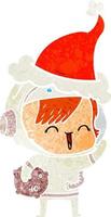 cartone animato retrò di una ragazza spaziale felice che tiene la roccia della luna che indossa il cappello di Babbo Natale vettore