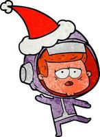 strutturato cartone animato di un' stanco astronauta indossare Santa cappello vettore