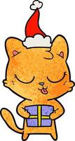 simpatico cartone animato strutturato di un gatto che indossa il cappello di Babbo Natale vettore