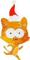 retrò cartone animato di un' sorpreso gatto in esecuzione indossare Santa cappello vettore