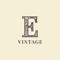 lettera e Vintage ▾ decorazione logo vettore design