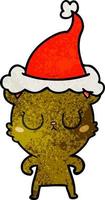 pacifico cartone animato strutturato di un orso che indossa il cappello di Babbo Natale vettore