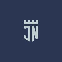 jn logo monogramma con fortezza castello e scudo stile design vettore