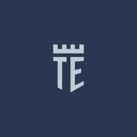 TE logo monogramma con fortezza castello e scudo stile design vettore