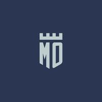 mo logo monogramma con fortezza castello e scudo stile design vettore