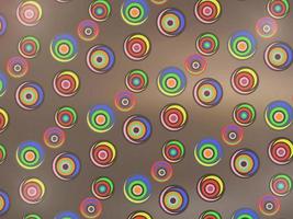 carino colorato spirale cerchi su splendore Marrone astratto sfondo vettore