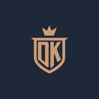 dk monogramma iniziale logo con scudo e corona stile vettore