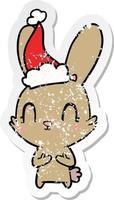 carino afflitto etichetta cartone animato di un' coniglio indossare Santa cappello vettore