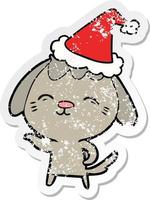 felice cartone animato adesivo angosciato di un cane che indossa il cappello di Babbo Natale vettore