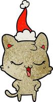 felice cartone animato strutturato di un gatto che indossa il cappello di Babbo Natale vettore