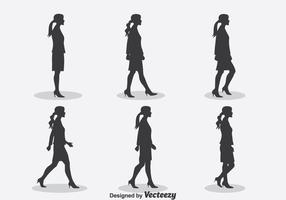 Vettore del ciclo della passeggiata della siluetta della donna