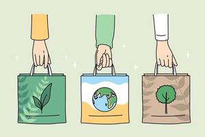 ecologia cura e eco-friendly cose concetto. umano mani Tenere eco-friendly borse con immagini di pianta pianeta e albero vettore illustrazione