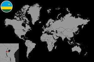 mappa pin con bandiera ruanda sulla mappa del mondo. illustrazione vettoriale. vettore