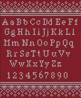 Natale font. a maglia latino alfabeto su senza soluzione di continuità a maglia modello con i fiocchi di neve e abete. nordico giusto isola maglieria, inverno vacanza maglione design. vettore illustrazione.