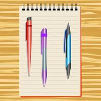 taccuino, rosso penna, viola penna e blu penna su un' di legno tavolo vettore