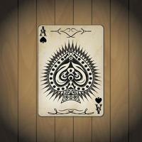 asso di picche, carte da poker su uno sfondo di legno vettore