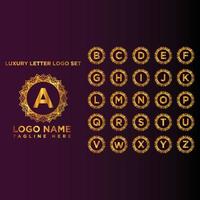 lusso ornamentale d'oro lettera logo impostato vettore