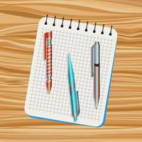 taccuino, arancia penna, blu penna e Marrone penna su un' di legno tavolo vettore