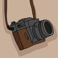 macchina fotografica d'epoca con cinturino vettore