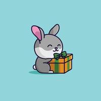 carino cartone animato coniglio con pacco regalo vettore