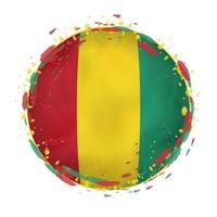 il giro grunge bandiera di Guinea con spruzzi nel bandiera colore. vettore