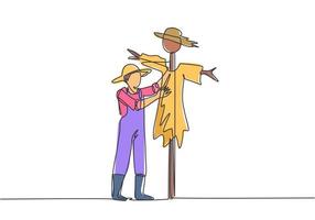 continua una linea che disegna un giovane agricoltore maschio con un cappello di paglia sta mettendo uno spaventapasseri per tenere lontani i parassiti degli uccelli. concetto minimalista agricolo. illustrazione grafica vettoriale di disegno a linea singola.