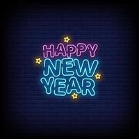 felice anno nuovo insegne al neon stile testo vettoriale